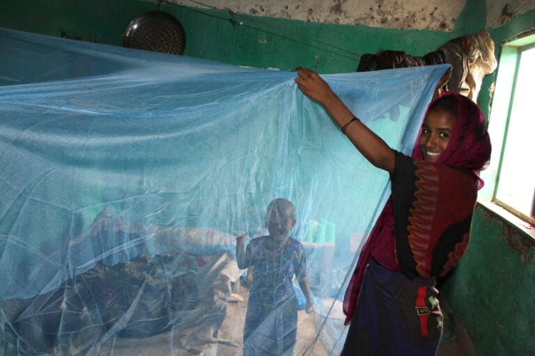 Distributing Zanzira bed nets in Amhara State