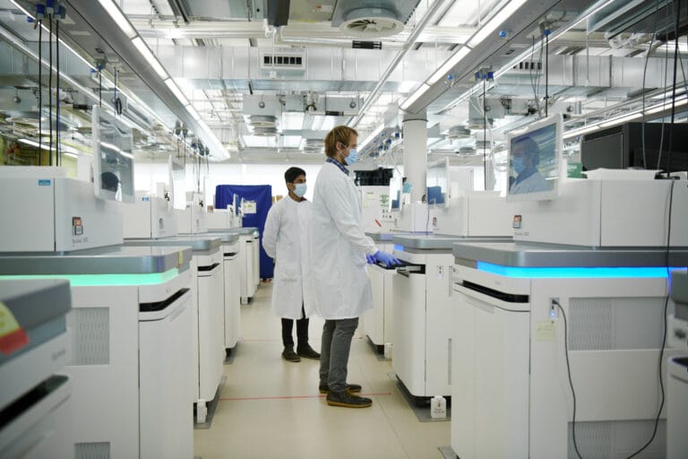 scientists in a lab using scientific equipment