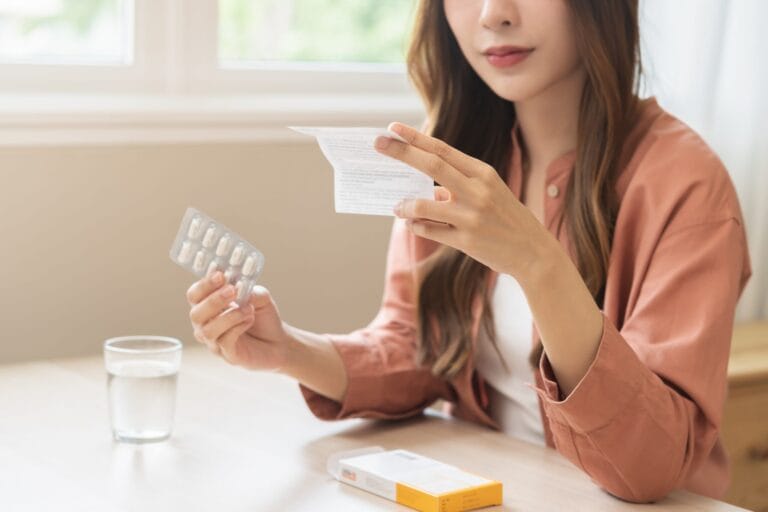 Patient holding a prescription.