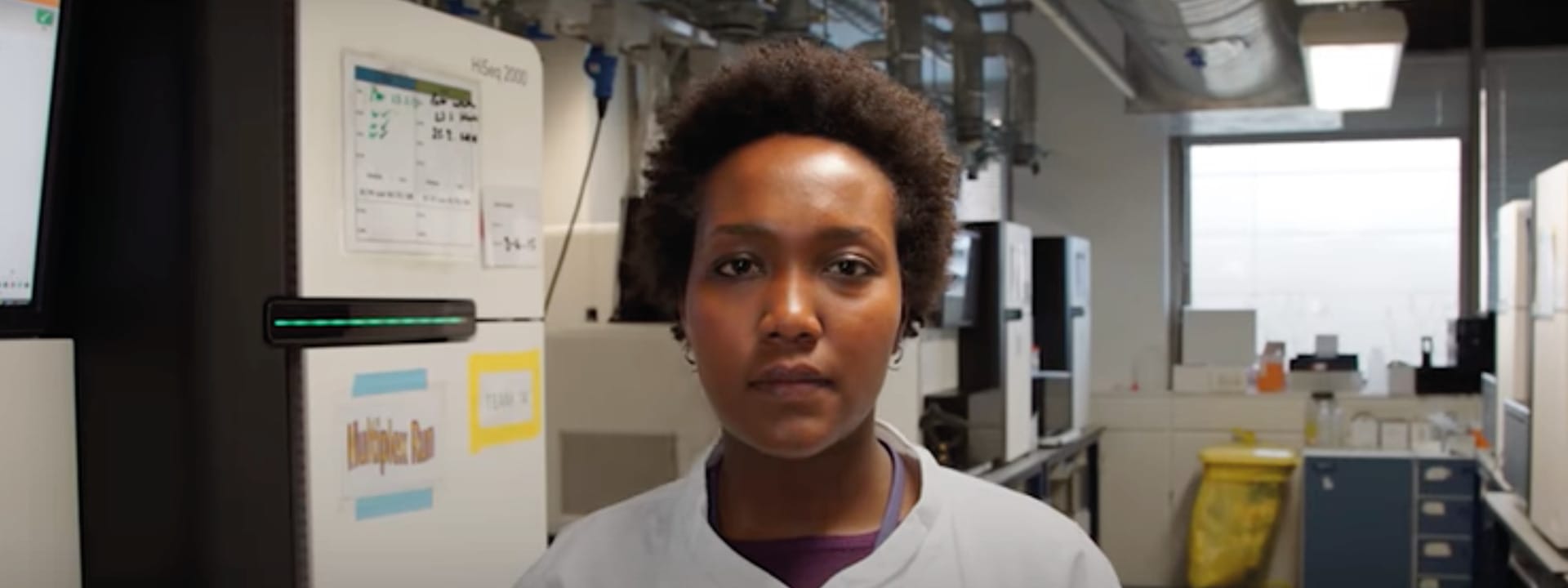 Picture of Christine standing within a lab.