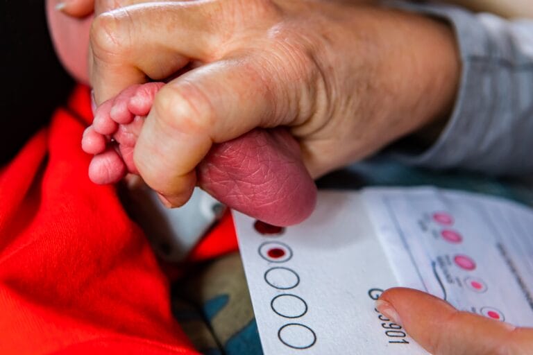 New born babys foot being used to sequence their genomics