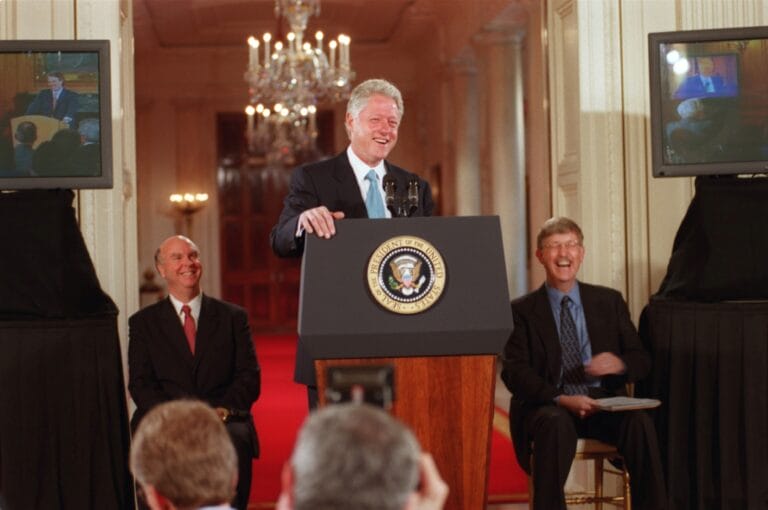 US President Bill Clinton on the podium smiling happily