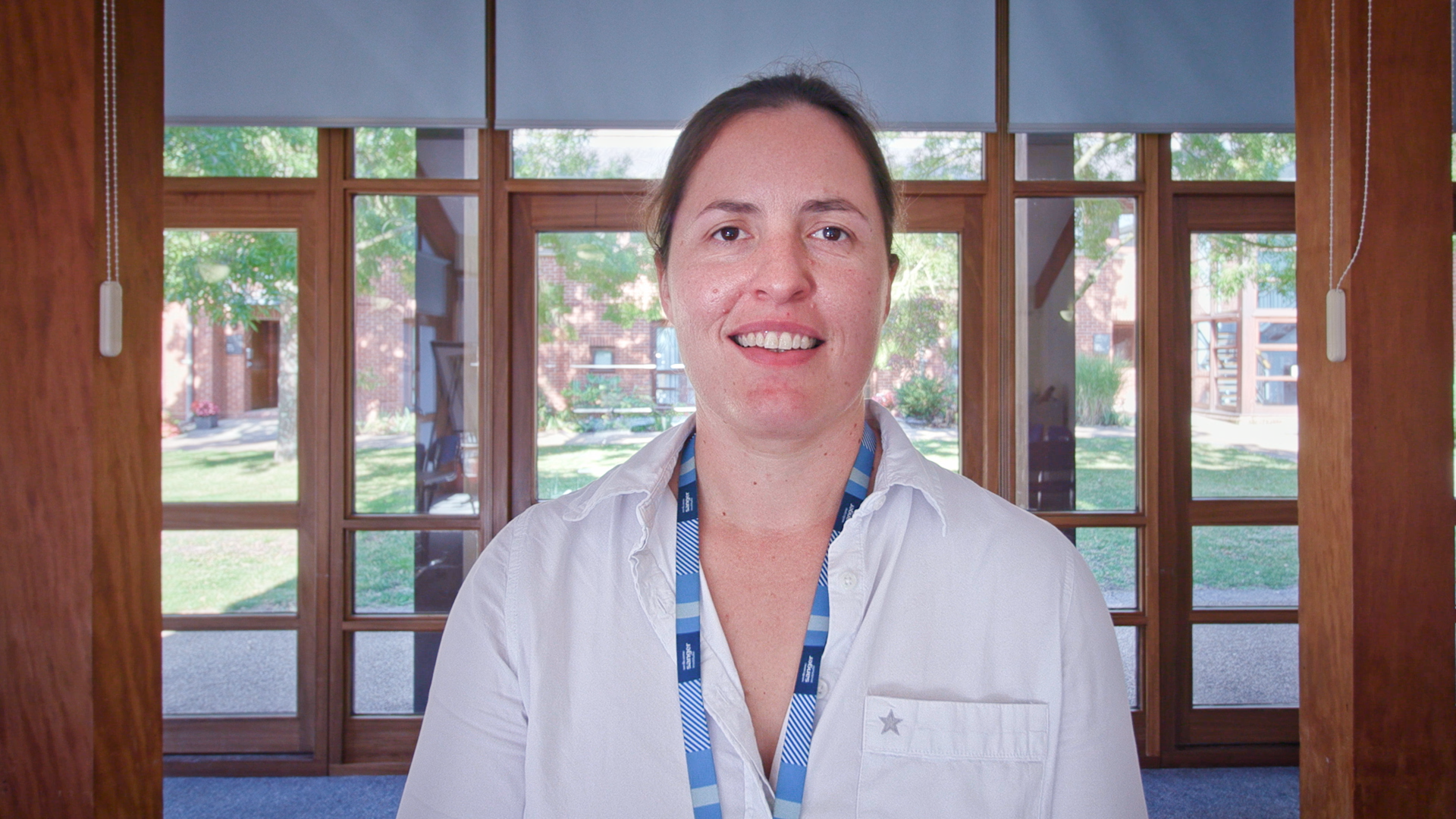 Picture of Sarah smiling on the Wellcome Genome Campus